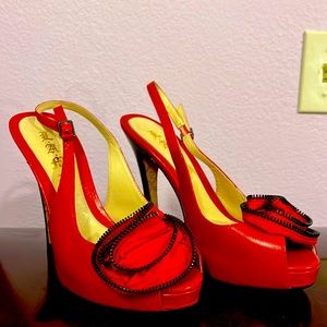 L.A.M.B. Red leather heels with zipper rose